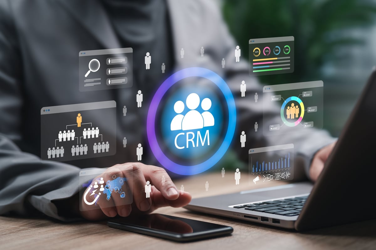 Businessman using a CRM system to enhance customer relationship management through data analytics and automation